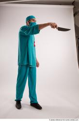 Man Adult Average White Fighting with knife Standing poses Casual